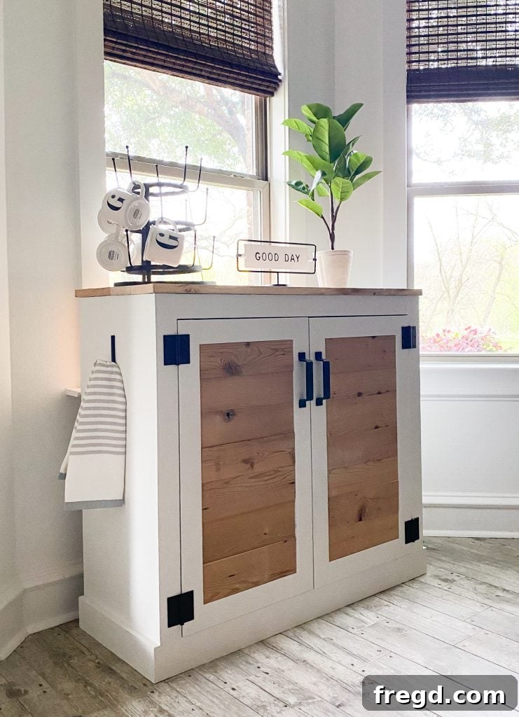 Your DIY Modern Farmhouse Brew Hub 3 Close-up view of the updated coffee cabinet, highlighting the intricate mesh doors and well-organized internal shelving, ideal for any coffee machine and accessories.