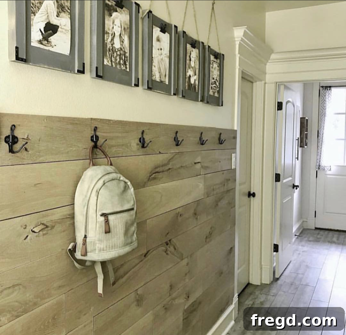 My Hallway Got A Major Glow-Up 2 Before image of a hallway with barn wood treatment on the lower walls.