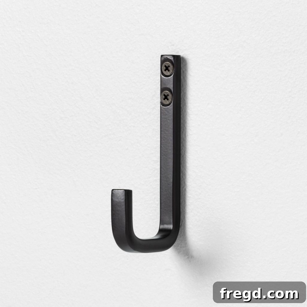 My Hallway Got A Major Glow-Up 9 Image of decorative wall hooks for backpacks.