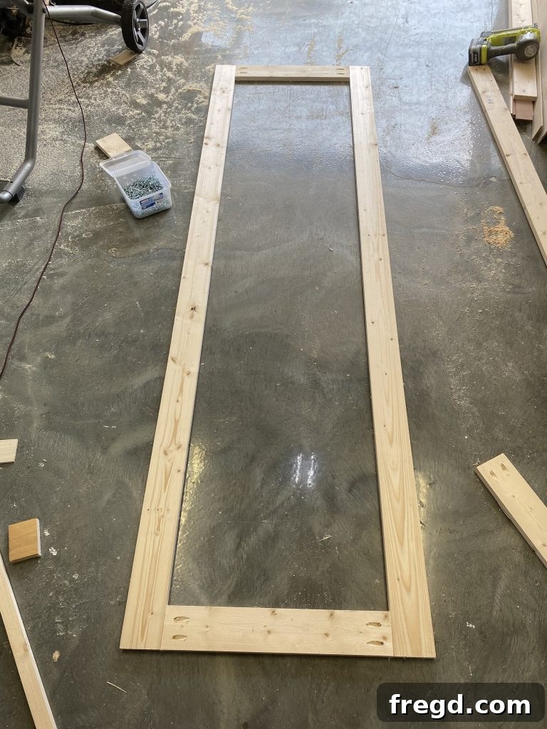 The assembled outer frame of the barn door before adding inner supports.