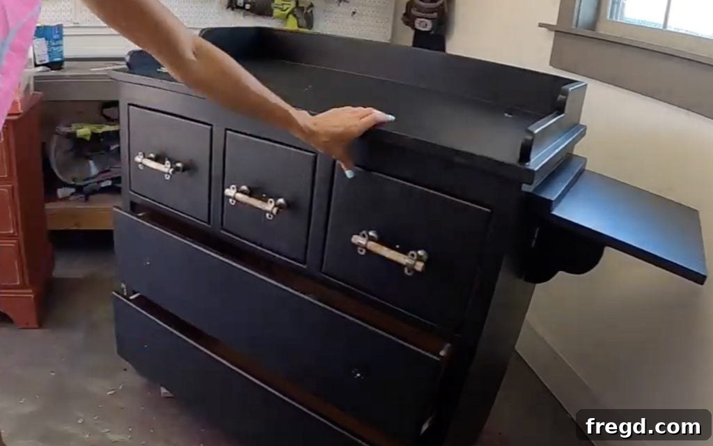 Your Guide to Furniture Makeovers 15 New hardware installed on the refinished dresser