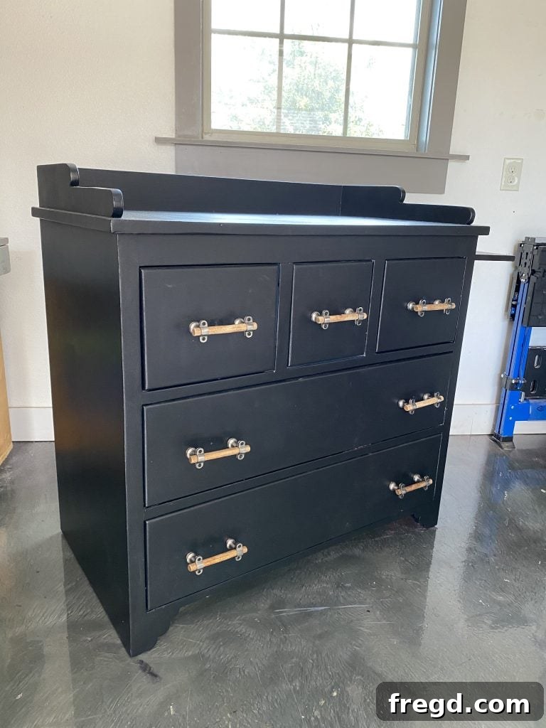 Your Guide to Furniture Makeovers 17 Refinished dresser in Tricorn Black with new hardware