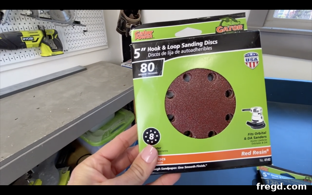 Your Guide to Furniture Makeovers 3 Sanding old dresser with 80-grit sandpaper