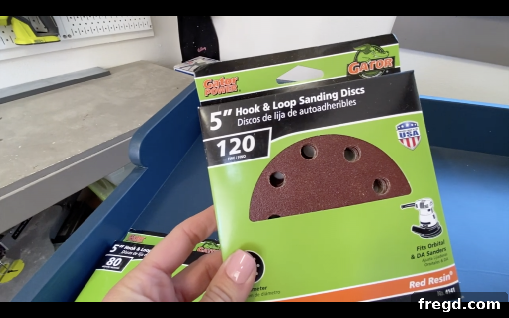 Your Guide to Furniture Makeovers 4 Sanding old dresser with 120-grit sandpaper
