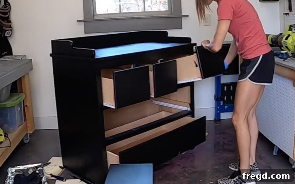 Your Guide to Furniture Makeovers 10 Painted dresser with drawers reinserted, ready for hardware
