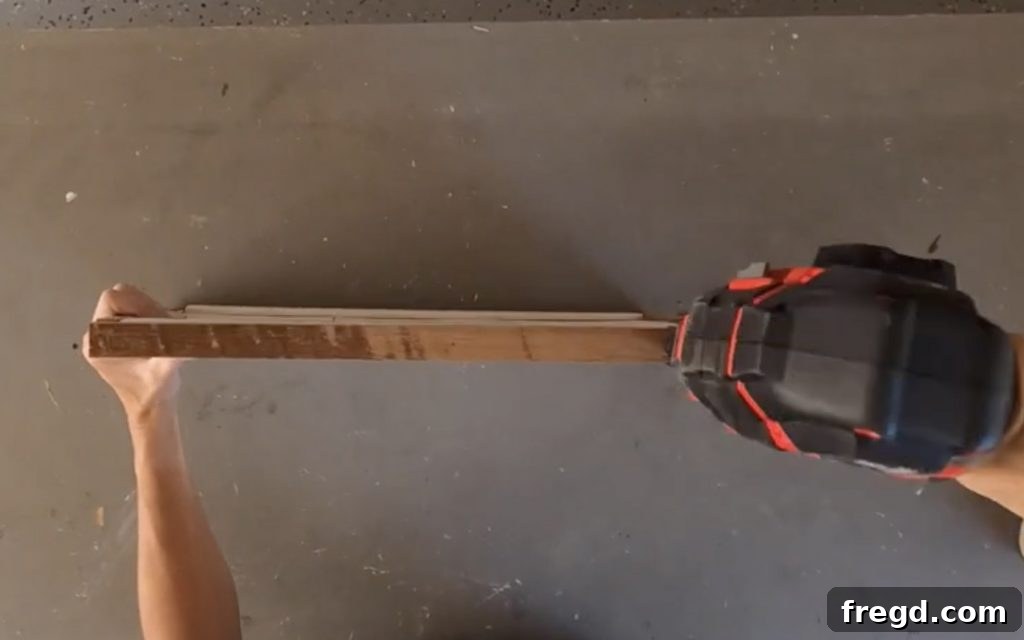 Attaching side trim pieces to the clip frame with brad nails and glue.