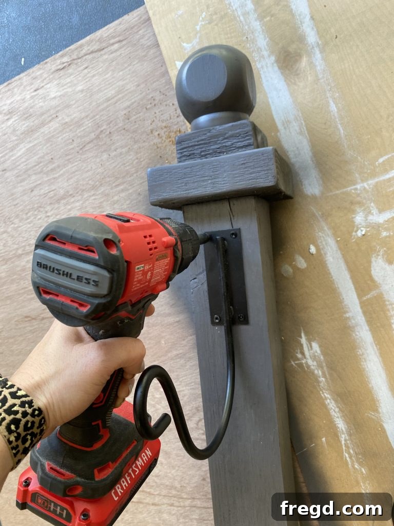 Close-up of the securely attached hose hook on the post