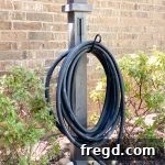 Finished DIY Water Hose Post with hose