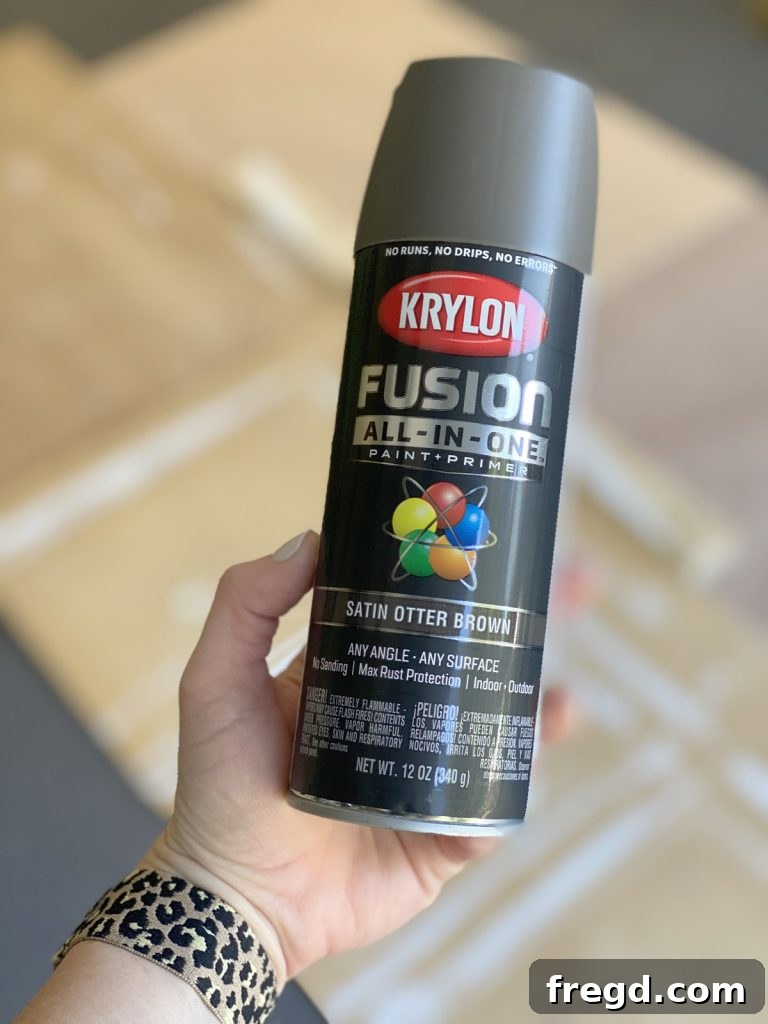 Garden hose post being spray painted with Krylon Fusion All-In-One