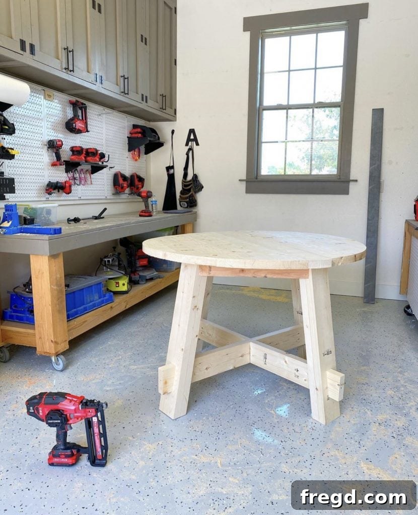 Applying a protective finish to the newly built DIY Round Dining Table.