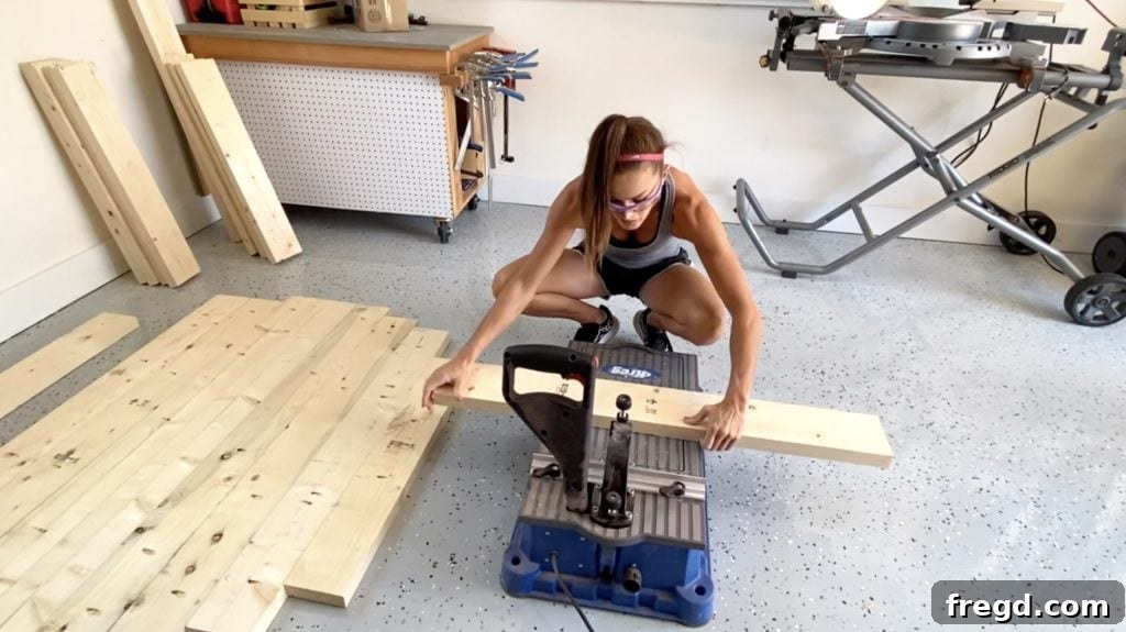 Wood planks being prepared with pocket holes for the table top assembly.