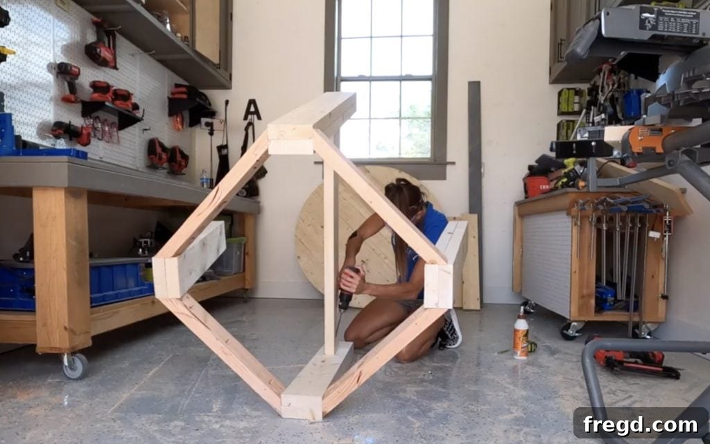 Attaching the long runner piece to the table legs with pocket hole screws.