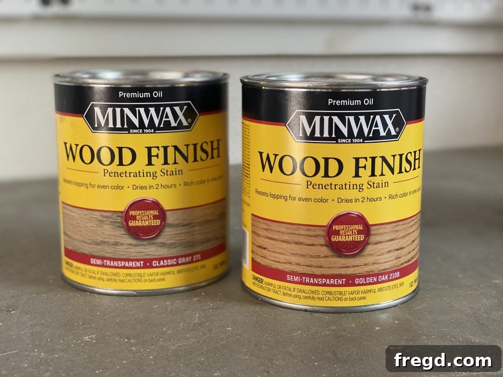 Your DIY Dry Erase Canvas 16 Two Minwax stain cans, Golden Oak and Classic Gray, with a mixed stain sample