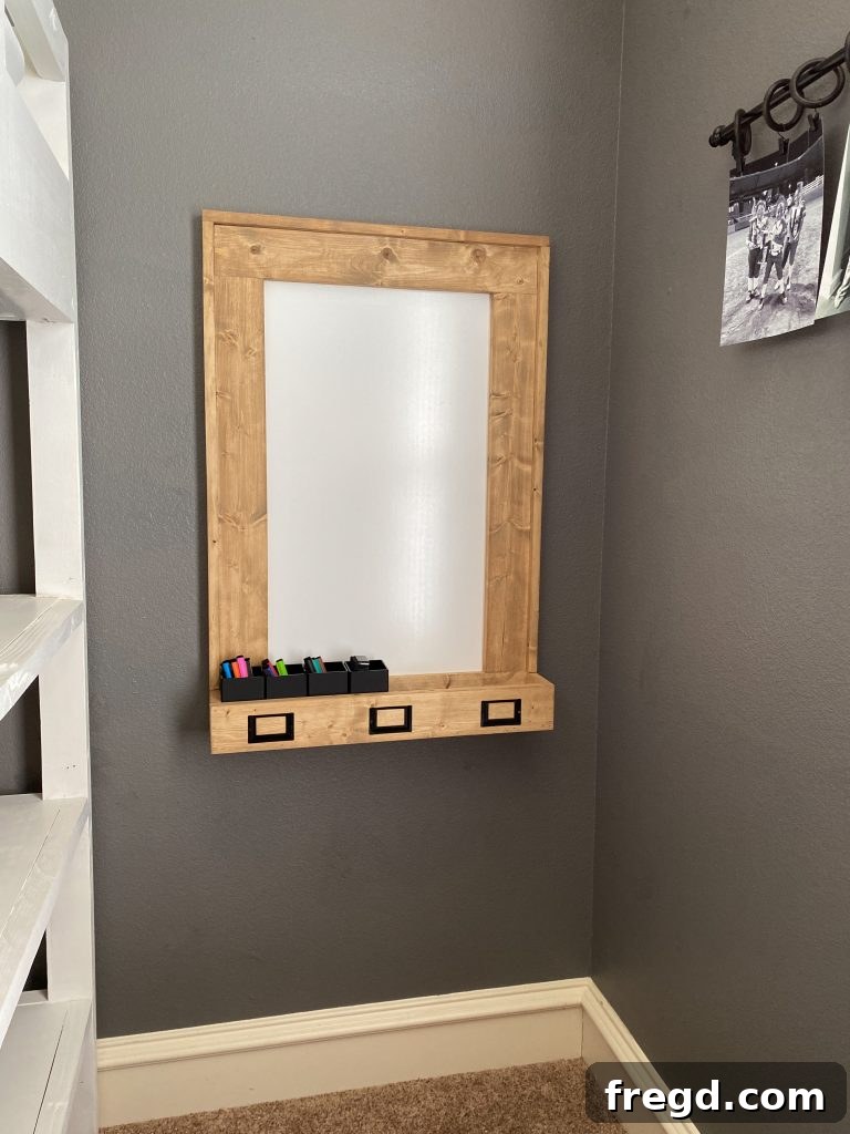 Your DIY Dry Erase Canvas 21 Close-up of the dry erase board with markers in its custom wooden holder, ready for use