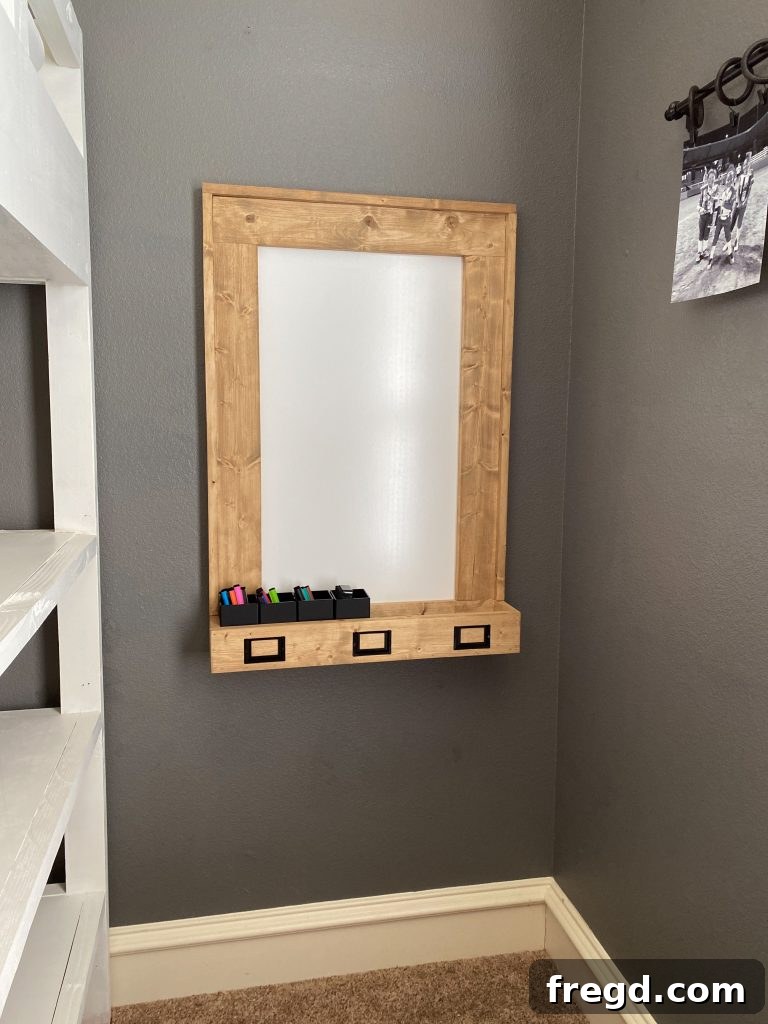 Your DIY Dry Erase Canvas 23 Side view of the DIY dry erase board, highlighting the depth of the wooden frame and pen holder
