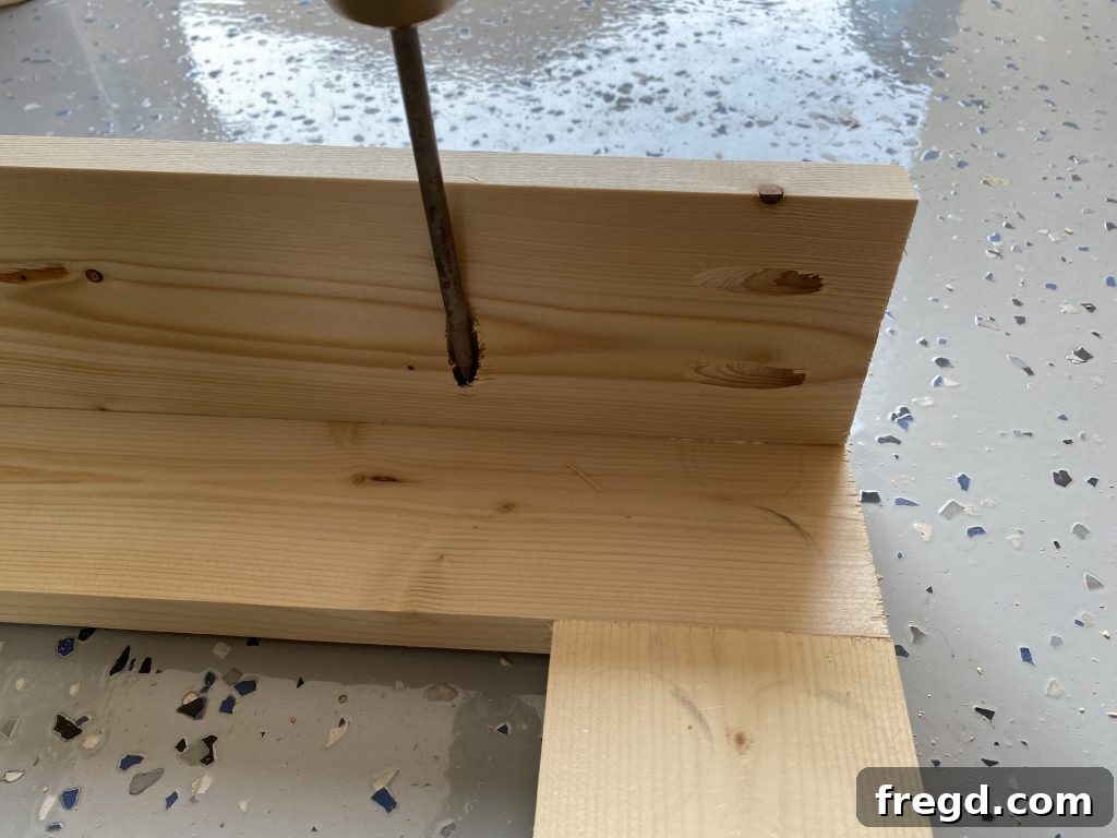 Your DIY Dry Erase Canvas 7 Bottom panel of the cup holder being attached to the main frame of the dry erase board