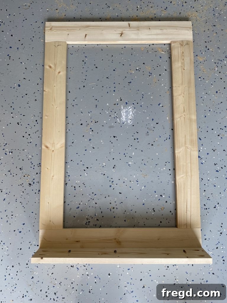 Your DIY Dry Erase Canvas 8 Assembled wooden frame with the bottom of the cup holder attached