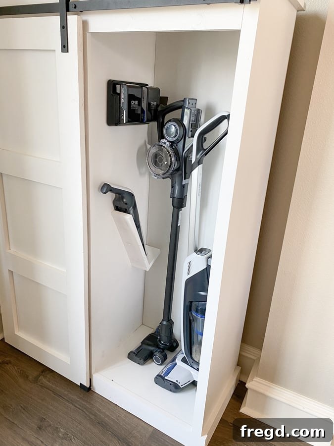 Close-up view of the cabinet's organized interior with cleaning tools