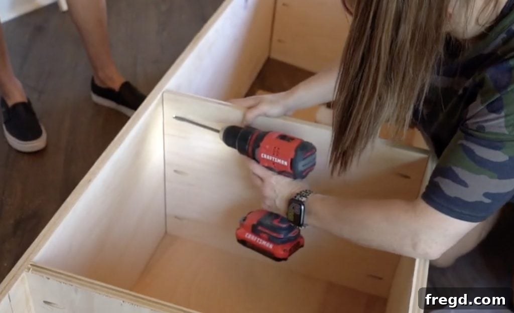 Shelves being attached inside the cabinet using pocket holes