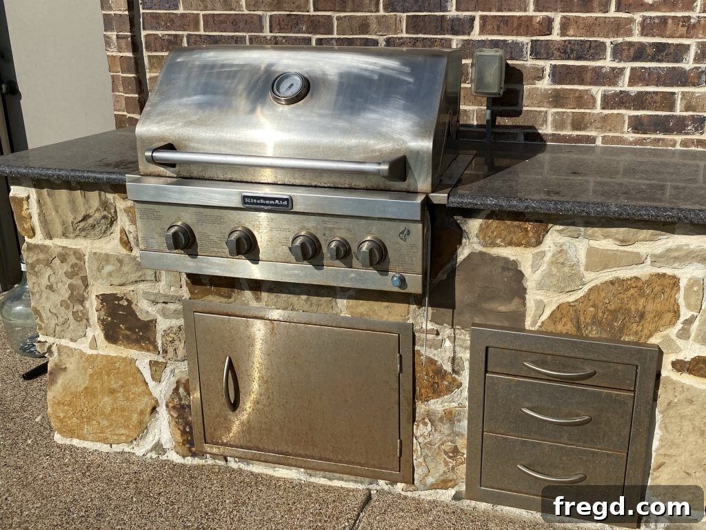 Transform Your Rusty Grill: Paint It Like New 2 Before shot of a rusty outdoor grill by a pool, showing extensive rust damage due to chlorine spray.