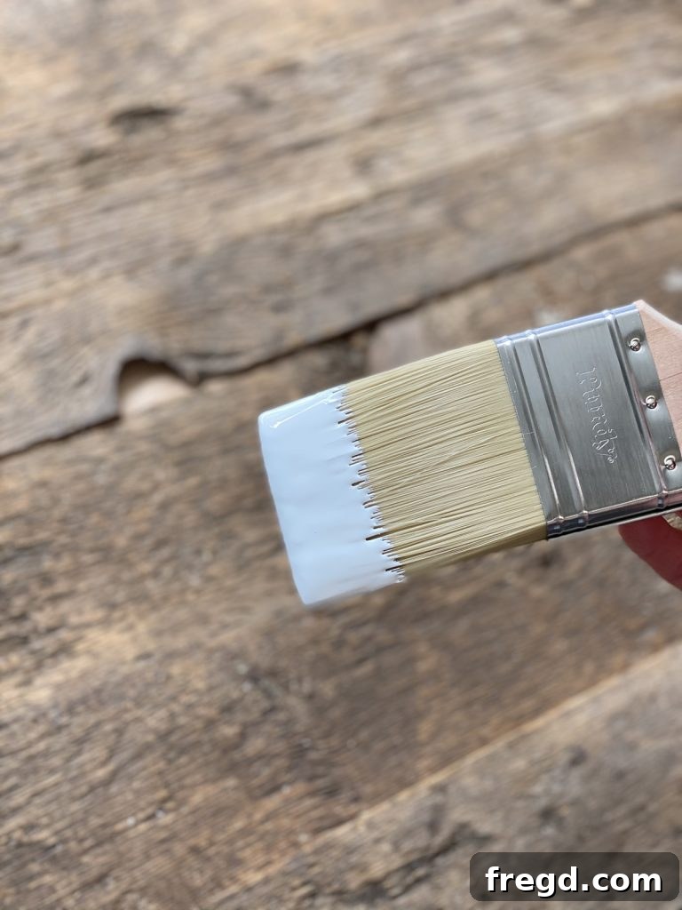 Smooth and thick paint application on the barn wood, highlighting the brush's effectiveness.