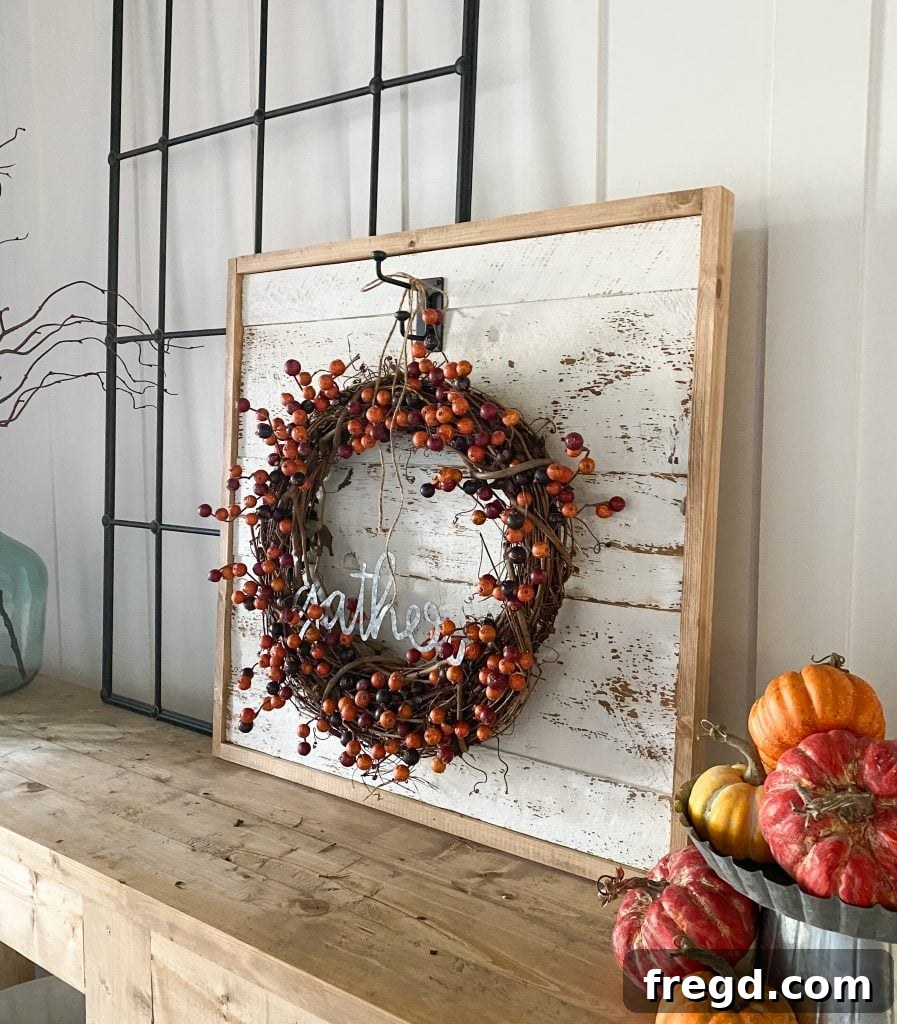 The completed DIY Farmhouse Wreath Display, showcasing a beautiful fall wreath.