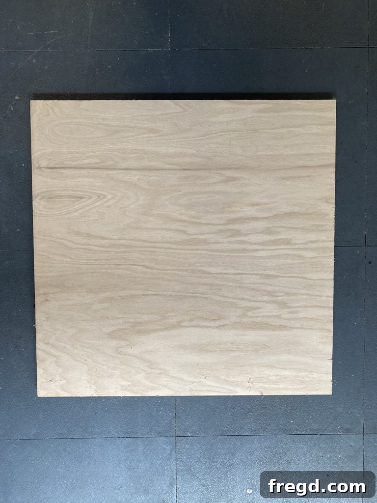Plywood base for a DIY wreath display, cut to size and ready for the next step.