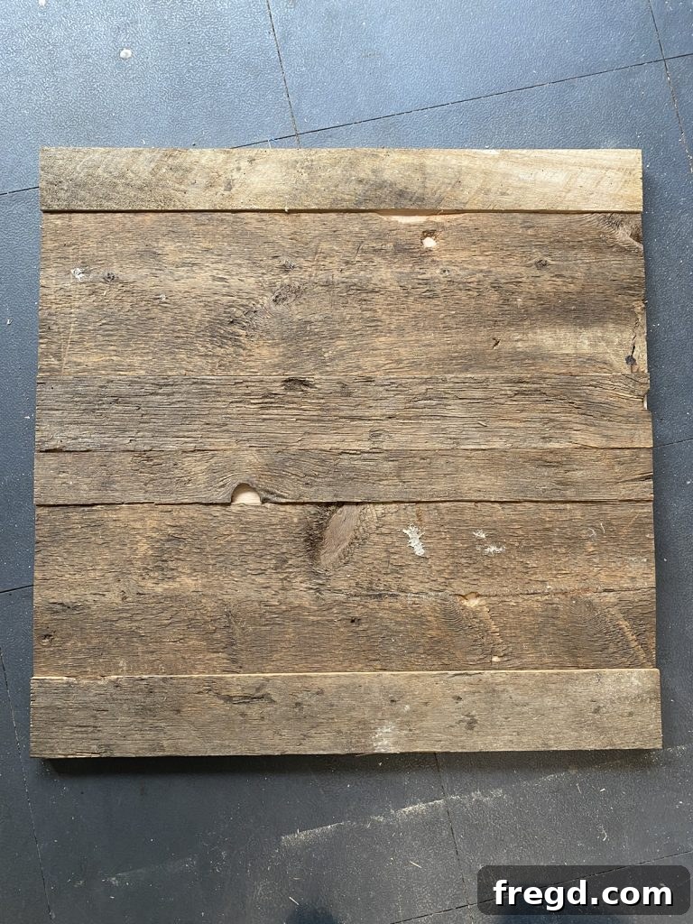 The plywood base completely covered with barn wood, creating a textured surface.