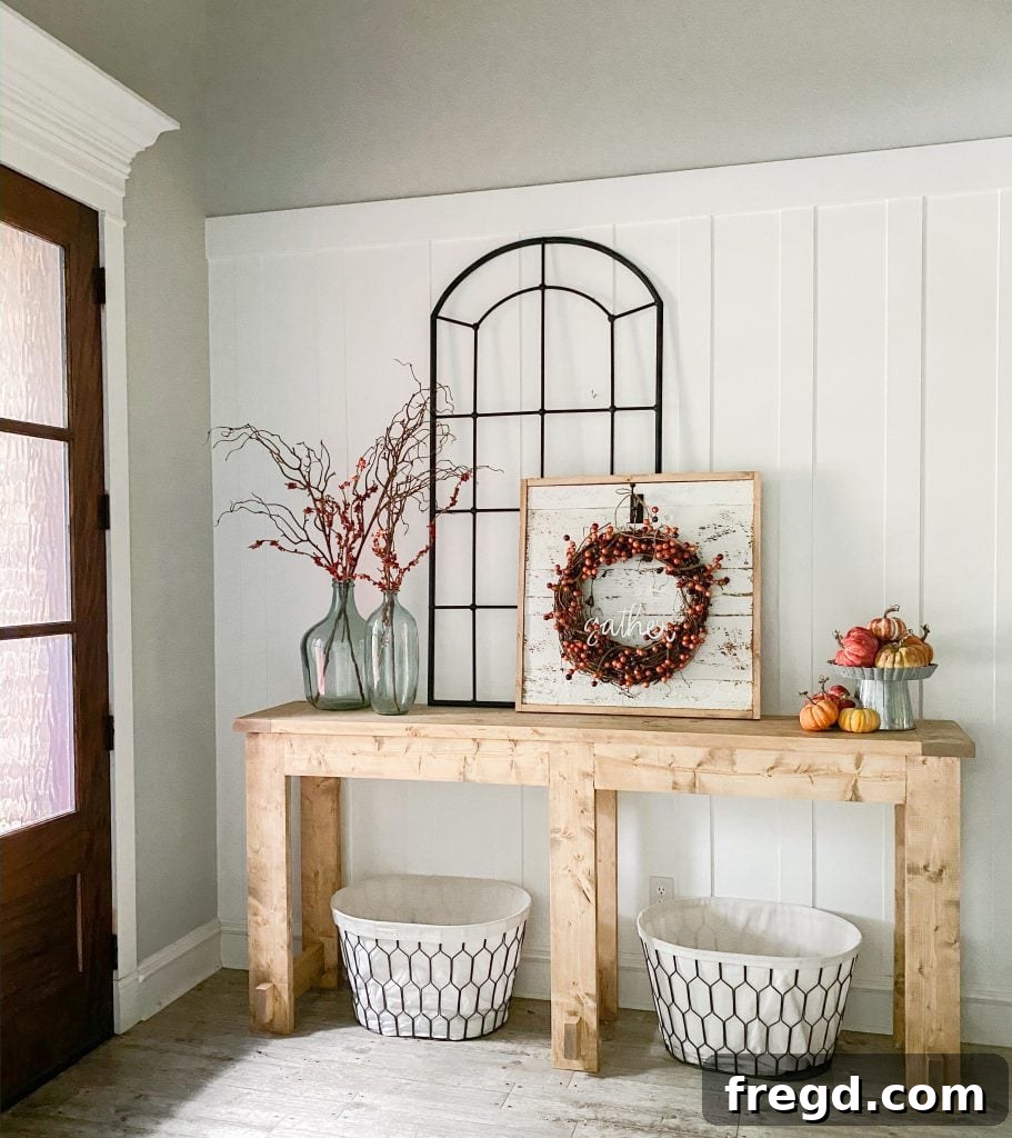 Finished farmhouse console table, beautifully decorated for the fall season, ready for Thanksgiving.