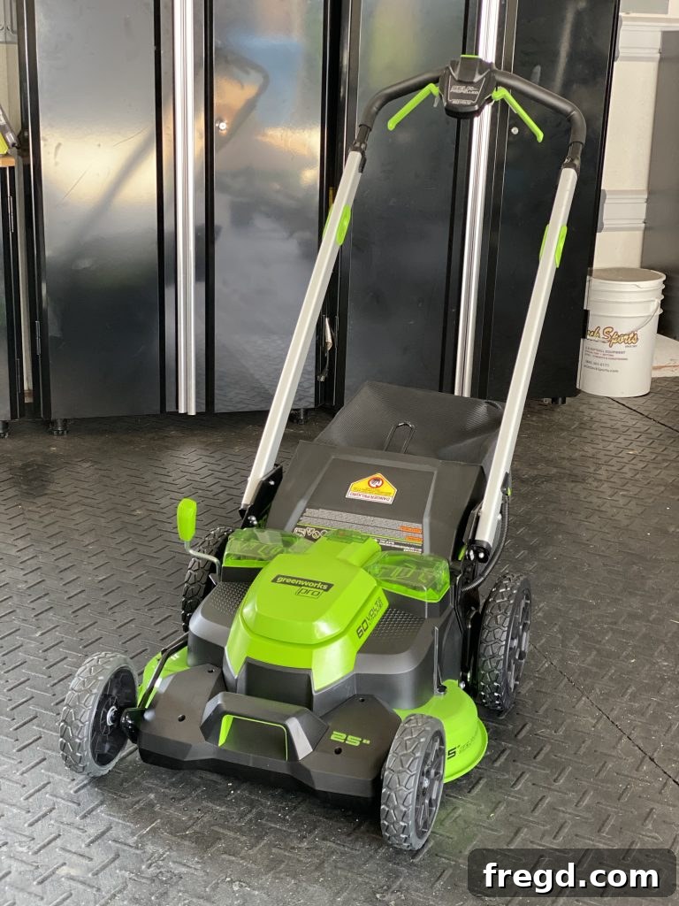 Greenworks 60-Volt Cordless Mower in action on a lush lawn