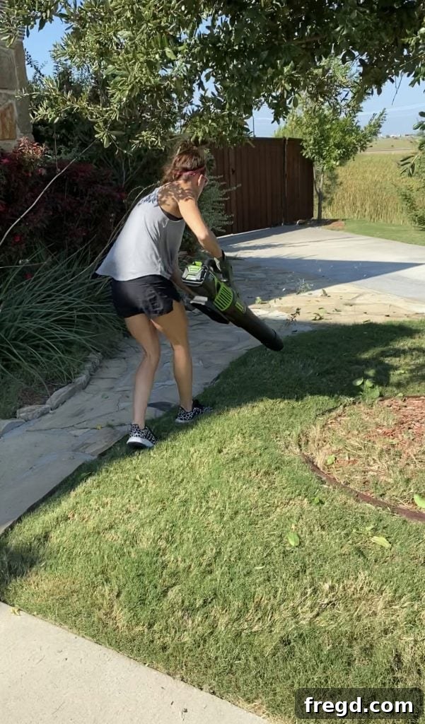 Greenworks 60-Volt Leaf Blower clearing debris