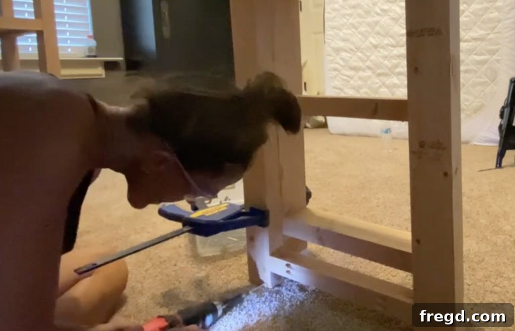 Attaching the completed ladder to the loft bed
