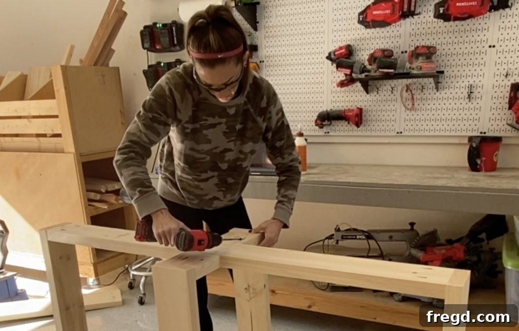 Farmhouse Fresh: Build Your Own Console 5 Securing front and back legs to the short runners of the console table base with glue and screws.