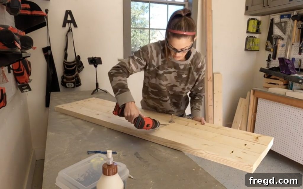 Farmhouse Fresh: Build Your Own Console 6 Joining plank boards for the console table top using pocket holes and clamps.