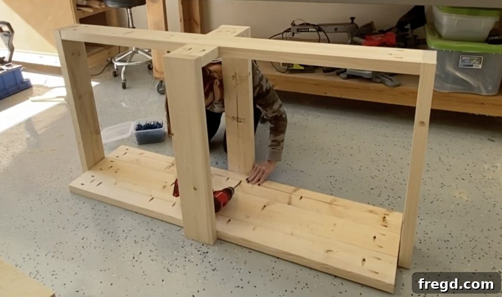 Farmhouse Fresh: Build Your Own Console 7 Attaching the assembled tabletop to the console table base with pocket hole screws.