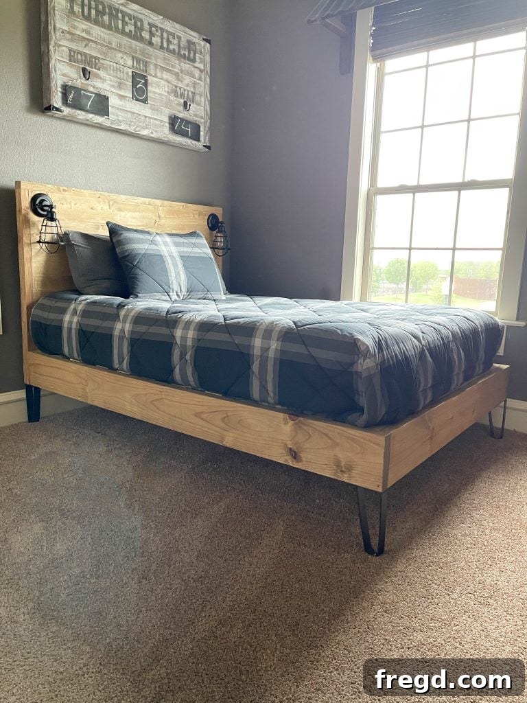 Completed modern DIY bed with bedding
