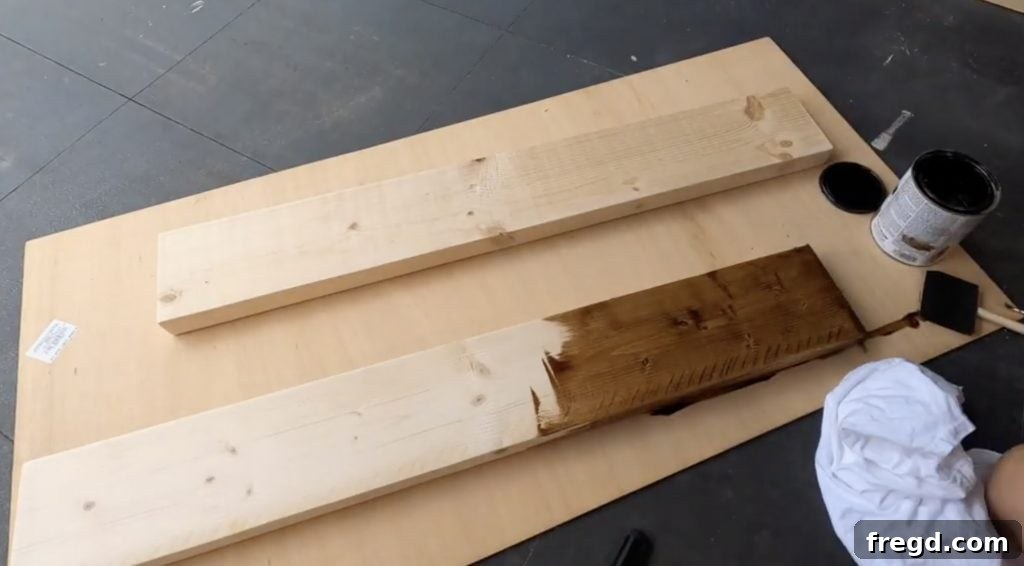 Inexpensive DIY Wall Shelves 12 Two pieces of lumber, freshly cut and stained with Golden Oak, ready for installation as shelves