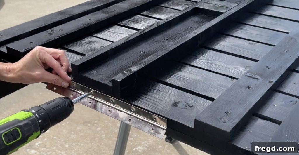 Attaching the piano hinge with screws