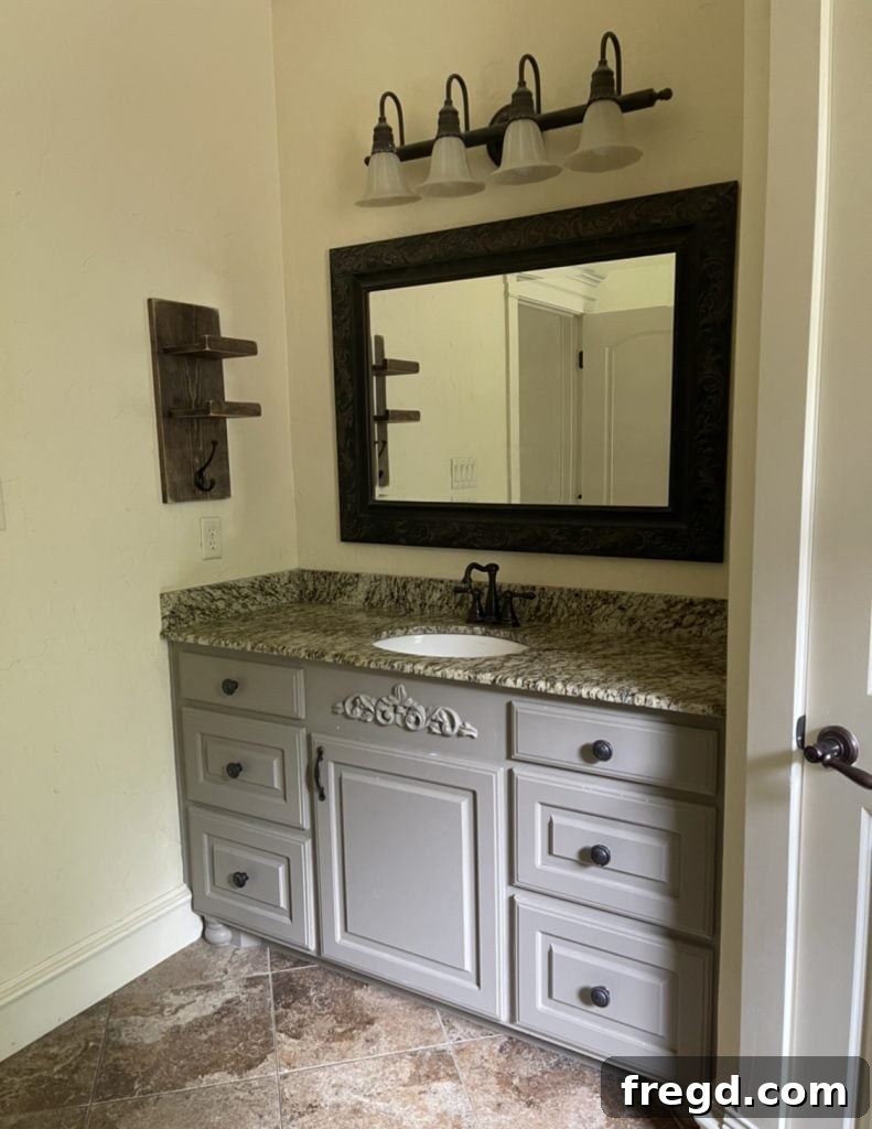 Before bathroom vanity showing old cabinet color