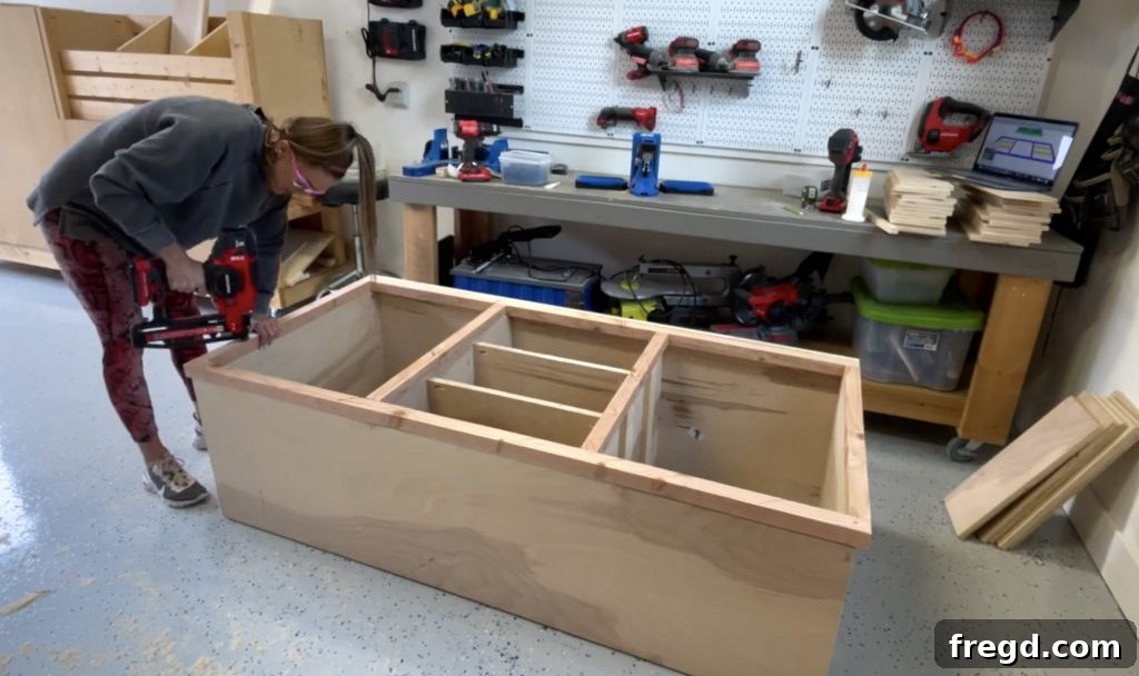 Attaching face frames to the front and back of the cabinet, ensuring flush alignment.
