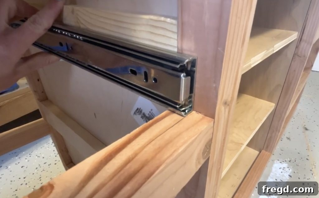 Installing drawer slides into the cabinet and onto the drawers for smooth operation.