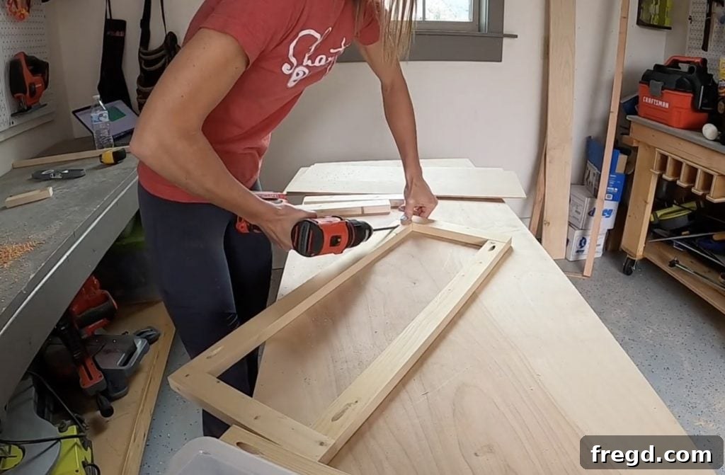 Assembling door frame pieces with pocket hole screws and wood glue.