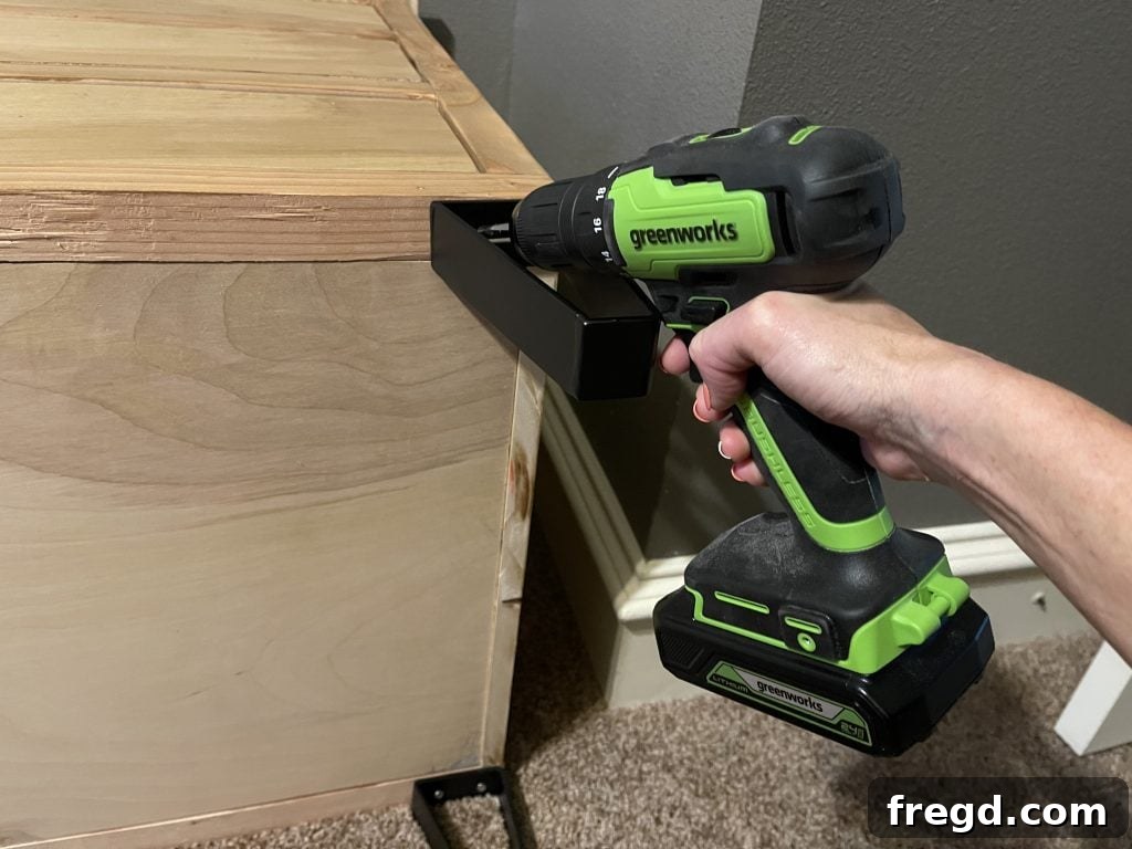 Final assembly of the modern dresser with hairpin legs, bar pulls, and exposed hinges.