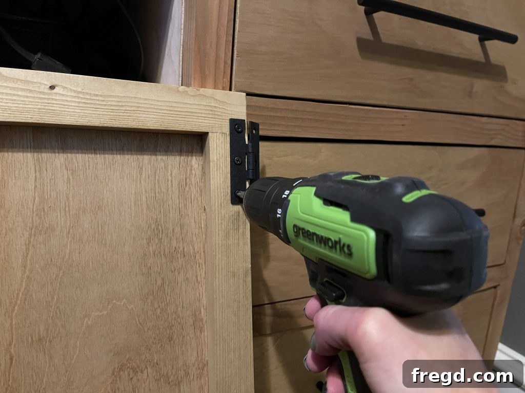 Detail shot of the modern dresser with hardware and a fresh finish.