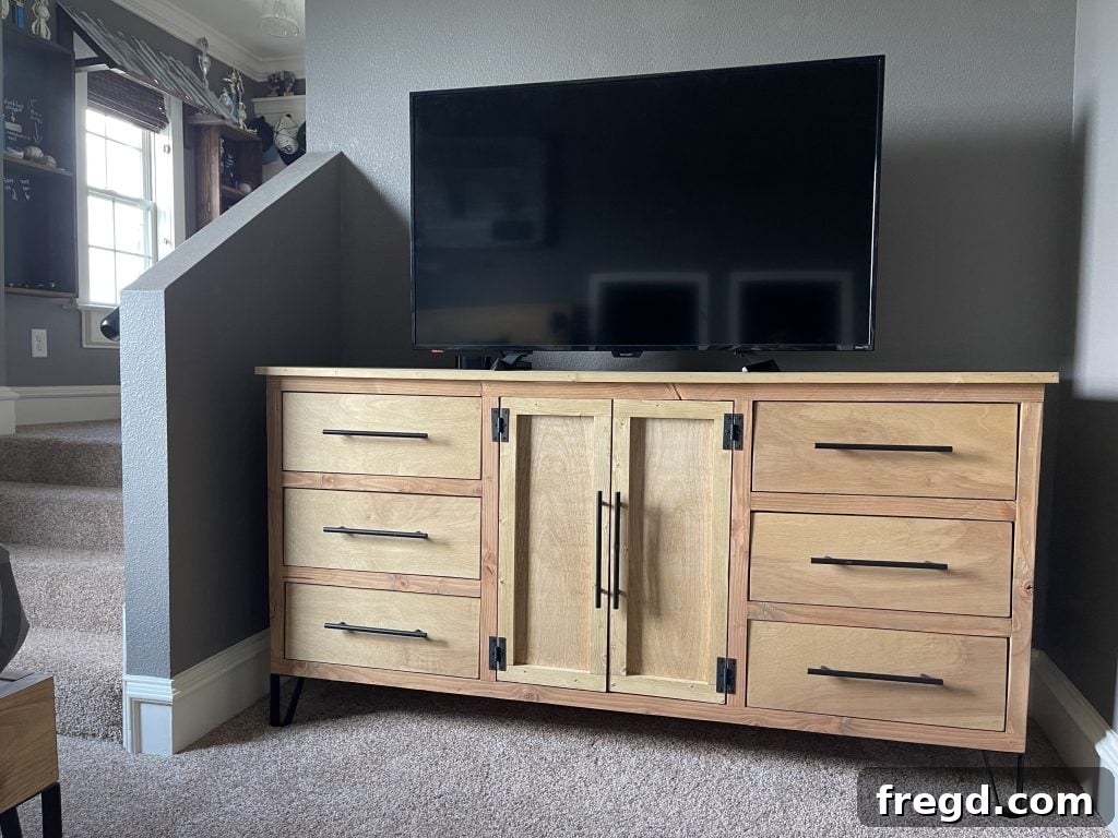 Stylish modern dresser with six drawers and media storage.