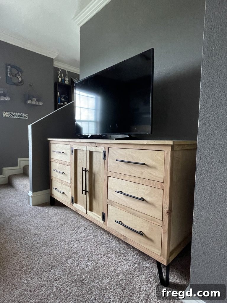 Close-up of the modern dresser with wooden top and sleek design.