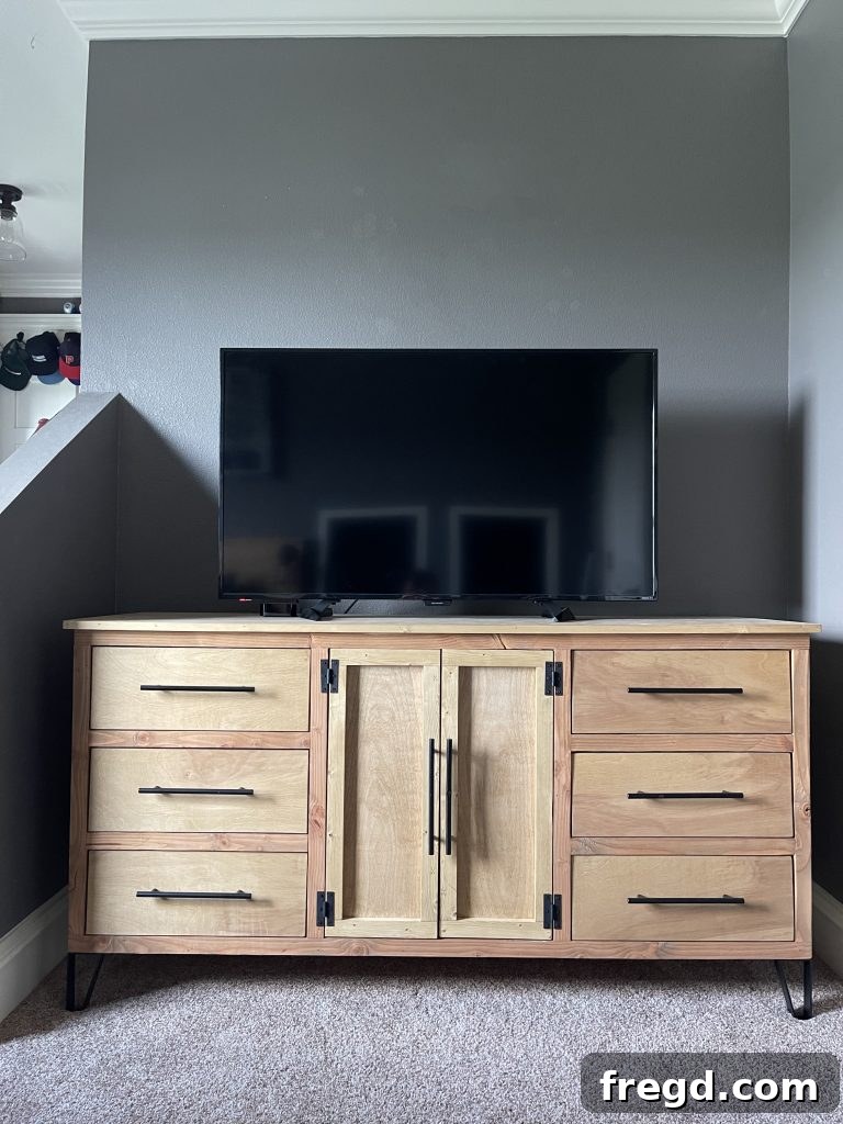 Modern dresser styling with decor.