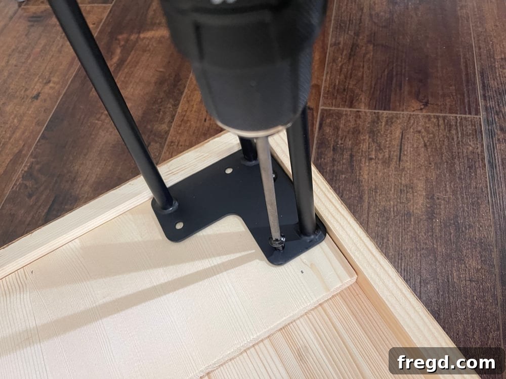 Finished tabletop waiting for legs, showcasing the custom stain and smooth finish.
