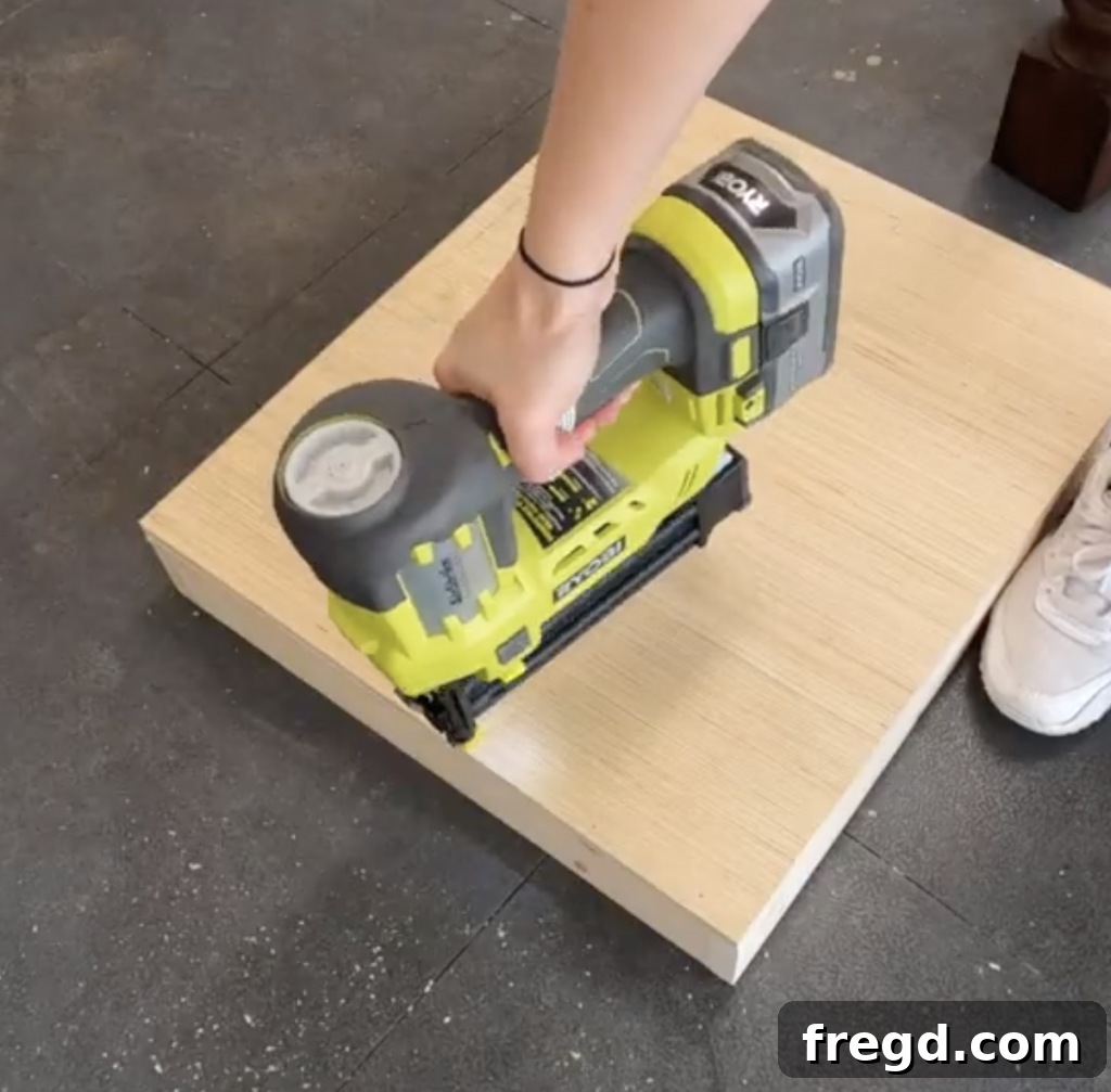 Build Your Own Modern Farmhouse Desk 17 Attach the base of the drawer using wood glue and brad nails