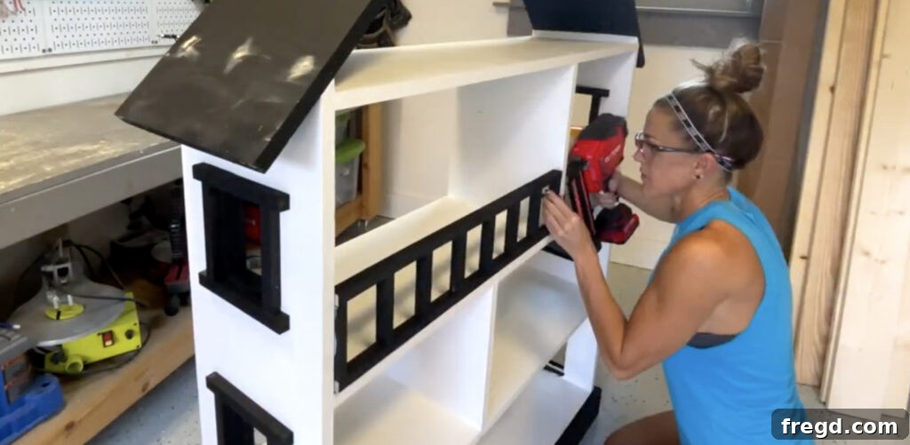Craft a Charming Dollhouse Book Nook 14 Attaching the completed railing to the top shelf of the dollhouse bookcase